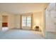 Spacious living room with a large window and an adjacent room at 4005 King Charles Rd, Durham, NC 27707