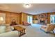 Cozy living room with a brick fireplace and built-in shelves at 4005 King Charles Rd, Durham, NC 27707