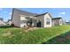 Spacious backyard with a patio, grill, and well-maintained lawn at 4020 Kinsley Trce, Burlington, NC 27215
