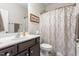 Bathroom featuring shower curtain, vanity, sink, and a mirror at 4020 Kinsley Trce, Burlington, NC 27215