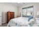 Comfortable bedroom with a wooden bed, side tables and a bright window with shades at 4020 Kinsley Trce, Burlington, NC 27215