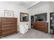 Cozy bedroom with wood dressers, sitting chair, TV, carpet and neutral walls at 4020 Kinsley Trce, Burlington, NC 27215