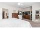 Bright bedroom with white ceiling fan, king bed, dressers and connecting bathroom and living room at 4020 Kinsley Trce, Burlington, NC 27215