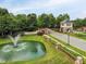 Mackintosh on the Lake entrance with water fountain and beautifully landscaped surroundings at 4020 Kinsley Trce, Burlington, NC 27215