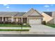 Inviting home exterior with a two-car garage, attractive landscaping, and a cozy front porch seating area at 4020 Kinsley Trce, Burlington, NC 27215