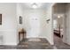 Bright foyer featuring hardwood floors, a white front door, and an open view to other rooms at 4020 Kinsley Trce, Burlington, NC 27215