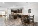 Open concept kitchen featuring stainless steel appliances, a kitchen island and dark wood cabinets at 4020 Kinsley Trce, Burlington, NC 27215