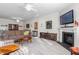Spacious living room offers ample seating, a fireplace, and a mounted TV at 4020 Kinsley Trce, Burlington, NC 27215