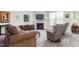 Comfortable living room includes a fireplace, a TV, and a cozy seating area at 4020 Kinsley Trce, Burlington, NC 27215