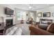 Bright living room has a fireplace, large windows, and comfortable seating at 4020 Kinsley Trce, Burlington, NC 27215
