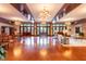 Spacious lobby with hardwood floors, elegant chandeliers, and ample seating areas at 4020 Kinsley Trce, Burlington, NC 27215