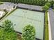 Aerial view of pristine tennis courts ready for a competitive match in a well-maintained community space at 4020 Kinsley Trce, Burlington, NC 27215