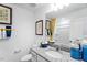 Well-lit bathroom featuring granite countertop, undermount sink, and decorative mirror at 410 Rowe Way, Knightdale, NC 27545