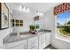 Bright bathroom with double vanity, granite countertops, and a large mirror at 410 Rowe Way, Knightdale, NC 27545