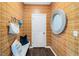 Stylish entryway features patterned wallpaper, a decorative mirror, and a bench with storage at 410 Rowe Way, Knightdale, NC 27545