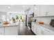 Bright, modern kitchen with granite countertops, stainless steel appliances, and a breakfast bar at 410 Rowe Way, Knightdale, NC 27545