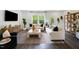 Inviting living room with modern furniture, large windows, and stylish decor at 410 Rowe Way, Knightdale, NC 27545