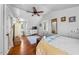 Bright bedroom featuring ceiling fan, hardwood floors, and a well-placed window with tons of natural light at 417 S Fourth St, Mebane, NC 27302