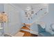Entryway featuring light blue walls, hardwood floors, stairs, and coat closet at 417 S Fourth St, Mebane, NC 27302