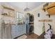 Functional laundry area boasting a stackable washer/dryer, ample storage, and stylish decor, blending utility with aesthetics at 417 S Fourth St, Mebane, NC 27302