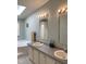 Bathroom with dual sinks, updated fixtures, and plenty of natural light at 4172 Copeland Ter, Graham, NC 27253