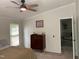 Bright bedroom with ceiling fan, neutral walls, and updated fixtures at 4172 Copeland Ter, Graham, NC 27253