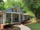 Beautiful front yard with lush trees and landscaping adding to the home's curb appeal at 4172 Copeland Ter, Graham, NC 27253