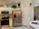 Well-equipped kitchen featuring stainless steel appliances and functional layout at 4172 Copeland Ter, Graham, NC 27253