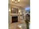 Spacious living room with fireplace, decor, and open layout to the kitchen at 4172 Copeland Ter, Graham, NC 27253