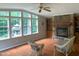 Spacious living room featuring natural light, hardwood floors, and stone fireplace at 4172 Copeland Ter, Graham, NC 27253