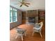 Bright living room with stone fireplace, built-in shelves, and large windows at 4172 Copeland Ter, Graham, NC 27253