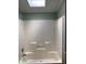 Standard shower featuring a simple design, grab bar and shower head at 4172 Copeland Ter, Graham, NC 27253