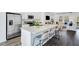 Bright kitchen featuring stainless steel appliances, granite counters, and an island with bar stool seating at 418 Rowe Way, Knightdale, NC 27545