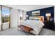 Cozy main bedroom with decorative blue accent wall, and lots of natural light at 418 Rowe Way, Knightdale, NC 27545