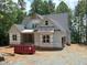 View of exterior with new construction details, including covered entry and building materials at 485 Chapel Ridge Dr, Pittsboro, NC 27312