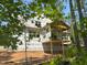 Exterior angle showcases a new build with covered deck construction and building supplies at 485 Chapel Ridge Dr, Pittsboro, NC 27312