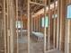 Spacious interior framed with wood, showing room layout with window views, awaiting personalization at 485 Chapel Ridge Dr, Pittsboro, NC 27312