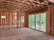 Framing of a spacious living room with large windows and sliding glass doors at 485 Chapel Ridge Dr, Pittsboro, NC 27312