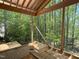 Unfinished porch featuring wood framing and a lovely view of the surrounding trees at 485 Chapel Ridge Dr, Pittsboro, NC 27312
