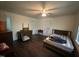 Bedroom features wood floors, ceiling fan, and ample space at 529 Sunset Dr, Fuquay Varina, NC 27526