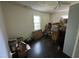 Bedroom features hardwood floors, a window, and ample space at 529 Sunset Dr, Fuquay Varina, NC 27526