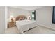 Inviting bedroom with a bed, side tables, lamps, and a window with blue curtains for soft lighting at 55 Boots Ridge Way, Franklinton, NC 27525