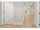 Bright hallway featuring light wood floors leading to a naturally lit living space at 55 Boots Ridge Way, Franklinton, NC 27525