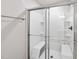 Modern glass-enclosed shower with built-in bench seating and sleek fixtures at 55 Boots Ridge Way, Franklinton, NC 27525