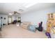 Open basement living space with carpet, exercise equipment, and a sofa at 5500 Fortunes Ridge Dr # 82B, Durham, NC 27713