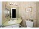 Compact bathroom with a single sink, vanity, and toilet, featuring a classic design at 5500 Fortunes Ridge Dr # 82B, Durham, NC 27713