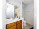 Basement bathroom with a single sink, vinyl flooring, vanity mirror, and a toilet at 5500 Fortunes Ridge Dr # 82B, Durham, NC 27713