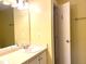 Bathroom with a sink, large mirror, and a built-in shelf at 5500 Fortunes Ridge Dr # 82B, Durham, NC 27713