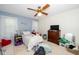 Bright bedroom with carpet, a ceiling fan, a large window, and an accent wall at 5500 Fortunes Ridge Dr # 82B, Durham, NC 27713