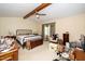 Spacious bedroom with a bed, vaulted ceiling, ceiling fan, and a window with light filtering curtains at 5500 Fortunes Ridge Dr # 82B, Durham, NC 27713